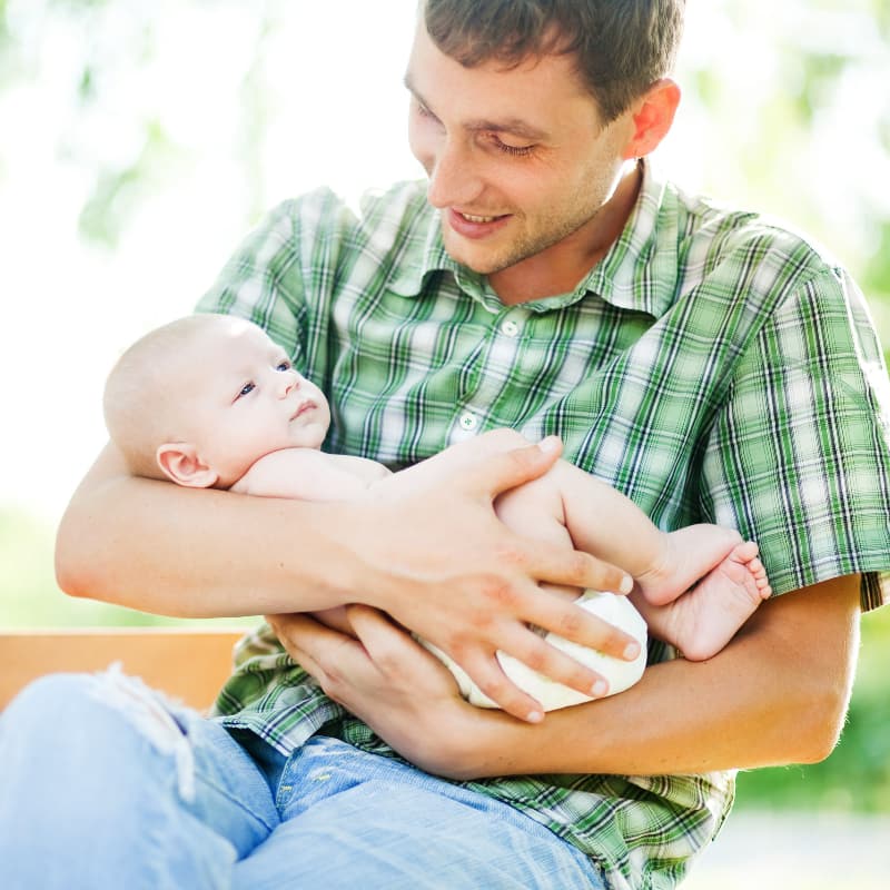 Father cradling his infant